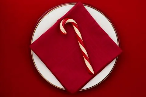 Candy cane on red background Stock Photos