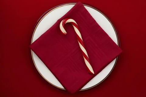 Candy cane on red background Stock Photos