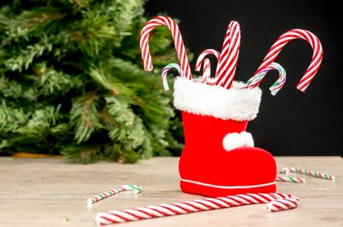 Candy canes in Christmas boot Stock Photos