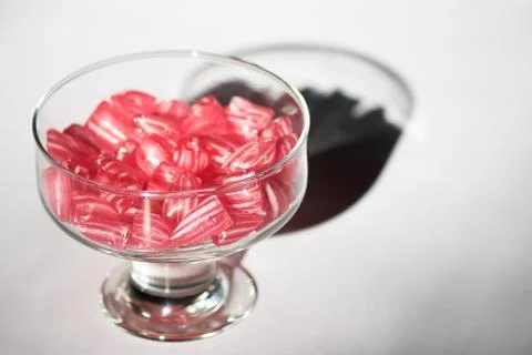 Candy canes in a glass cup. Stock Photos