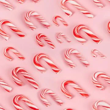 Candy canes on pink background - seamless pattern Stock Photos