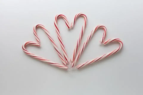 Candy canes in the shape of hearts Stock Photos
