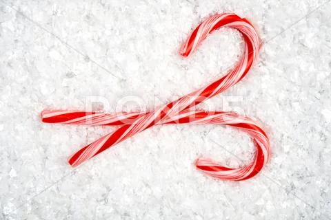 Candy canes in snow Stock Photos