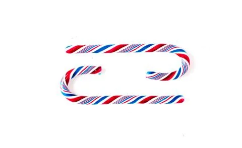 Candy canes on a white surface, top view, place for text Stock-Fotos