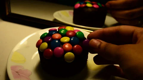 Candy on a choco muffin Stock Footage 36815824