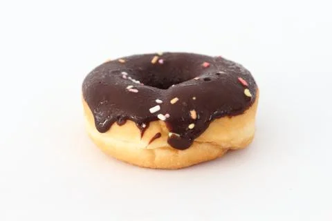 Candy, chocolate donuts on a white background. Stock Photos
