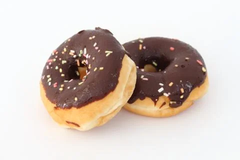 Candy, chocolate donuts on a white background. Stock Photos