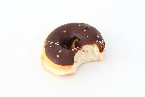 Candy, chocolate donuts on a white background. Stock Photos