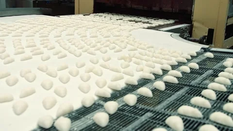 Candy-coated bonbons moving on conveyor belt in confectionery factory Stock-Footage 340605064