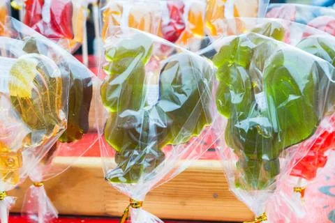 The candy cock on a stick in clear wrapper Stock Photos