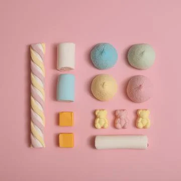 Candy composition made of fluffy marshmallows and gummy bears. Pastel minimal Stock Photos