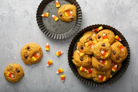 Candy corn and chocolate pumpkin cookies Stock Photos