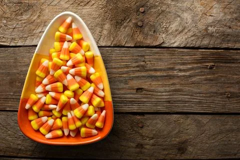 Candy corn in a bowl Halloween background Stock Photos