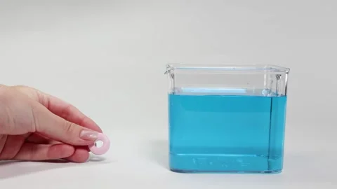 Candy Dropped in Water: Float or Sink Experiment Stock Footage 308984088