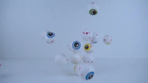 Candy eyes falling in slow motion. Halloween concept Stock Footage 95702472