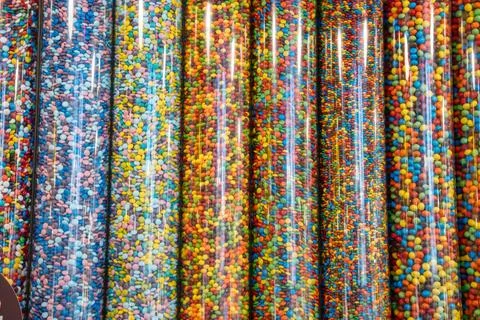 Candy-Filled Display Tubes in Store Stock Photos