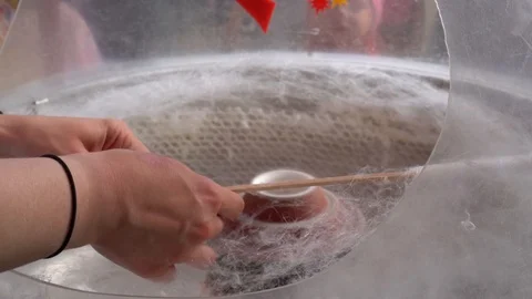 Candy floss machine with white candyfloss. Gimbal stabilizer motion shot Stock Footage 113675692