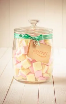 Candy jar filled with marshmallows and a tag Stock Photos