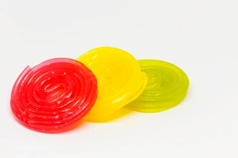 Candy laces in three different colors on white background Stock Photos