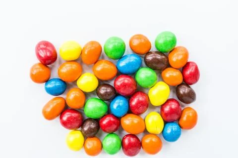 Candy lying on white background. Bright and Colorful sweets top view. Flat la 스톡 사진