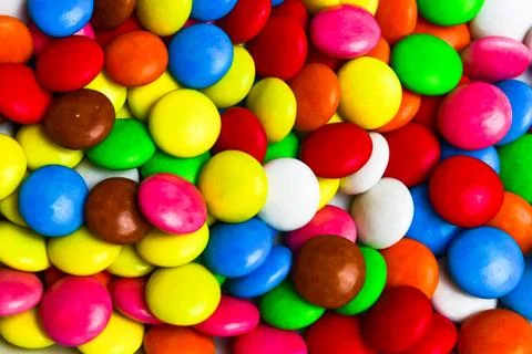Candy or pills colored in bright colors Stock Photos