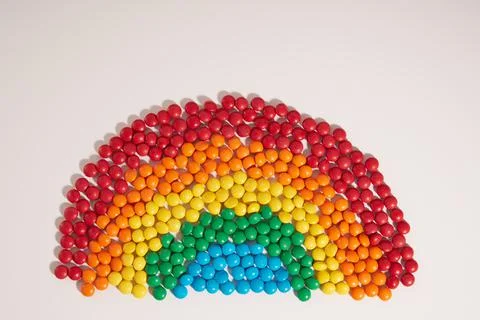Candy rainbow shape on white background Stock Photos