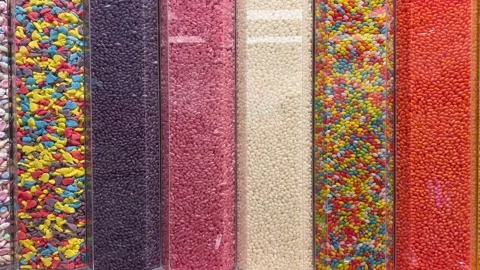 Candy scoop pile of soft pieces of barrel shaped, pink and white marshmallow Stock Footage 310421236