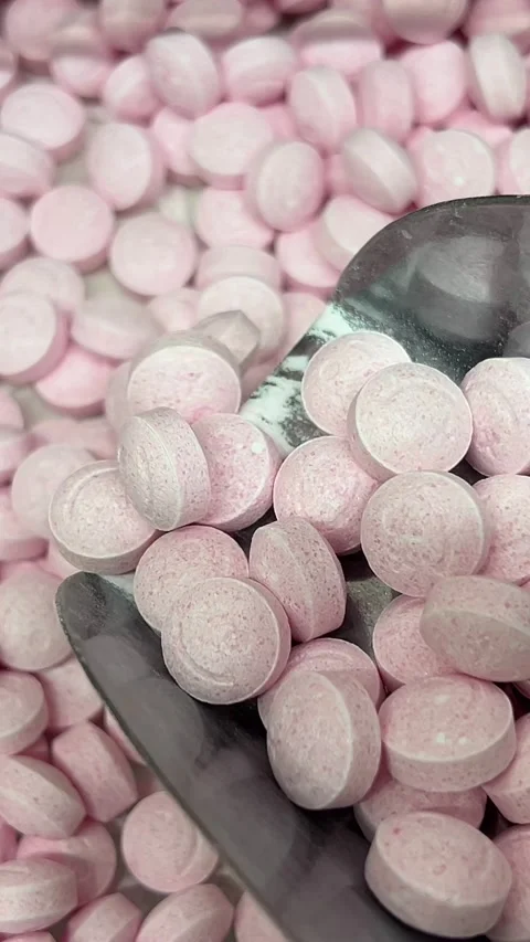 Candy scoop pile of soft pieces of barrel shaped, pink and white marshmallow Stock Footage 316050474