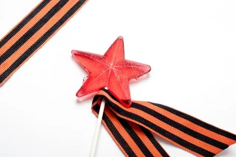Candy in the shape of a star, a red candy on a stick, Stock Photos
