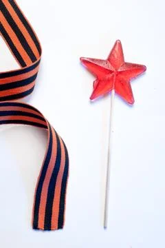 Candy in the shape of a star, a red candy on a stick, Stock Photos