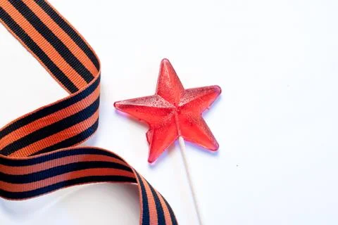 Candy in the shape of a star, a red candy on a stick, Stock Photos