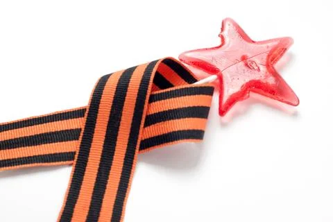 Candy in the shape of a star, a red candy on a stick, Foto stock