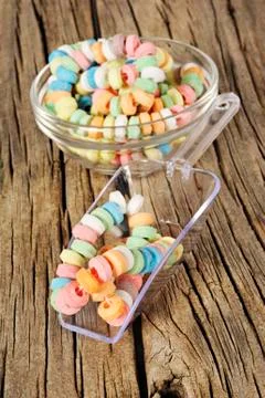 Candy on strings on wooden background Stock Photos