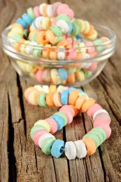 Candy on strings on wooden background Stock Photos