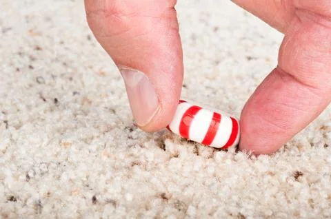 Candy stuck to carpet Stock Photos