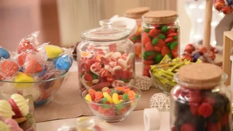 Candy table catering of sweets, lollipops, blackberries, liquorice, teeth Stock Footage 152303917