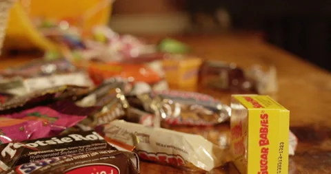 Candy on table rack focus Stock Footage 137058208