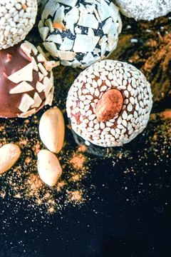 Candy, top view. Assorted chocolates on a dark background. Stock Photos