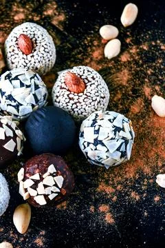 Candy, top view. Assorted chocolates on a dark background. Stock Photos