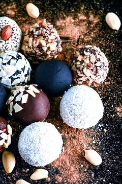 Candy, top view. Assorted chocolates on a dark background. Stock Photos