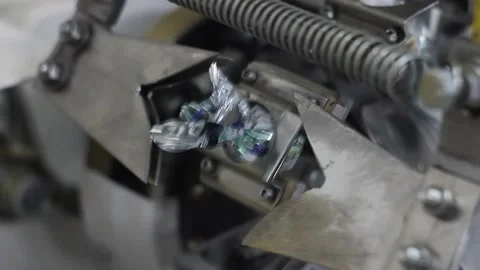 Candy wrapper. industrial packing line on factory. automation of production. con 動画素材 148349153