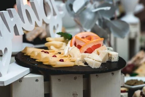 Candybar in a restaurant. Decorated white table fool of sweet pastry Stock Photos