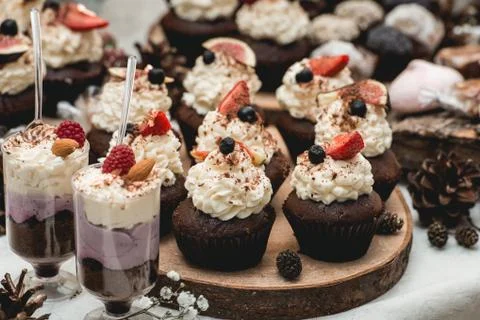 Candybar in a restaurant. Decorated white table fool of sweet pastry Stock Photos