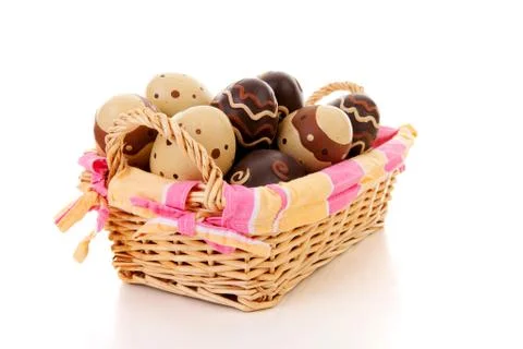 Cane basket with easter eggs Stock Photos