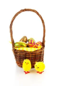 Cane basket with easter eggs Stock Photos