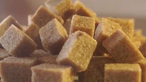 Cane lump sugar. rotating brown sugar cubes. Demerara golden brown sugar 012 Stock Footage 154175668