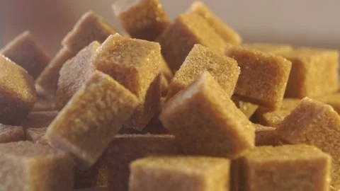 Cane lump sugar. rotating brown sugar cubes. Demerara golden brown sugar  01 Stock Footage 163655027
