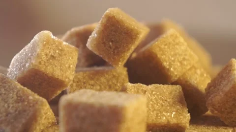Cane lump sugar. rotating brown sugar cubes. Demerara golden brown sugar  01 Stock Footage 163655273
