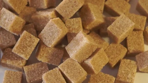 Cane lump sugar. rotating brown sugar cubes. Demerara golden brown sugar  01 Stock Footage 163655642