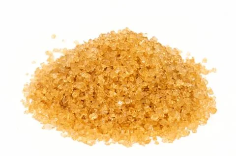 Cane sugar on white background . Stock Photos